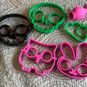 Assortment of silicone egg molds. Yolk goes in the eyes. Plus fish egg seperater